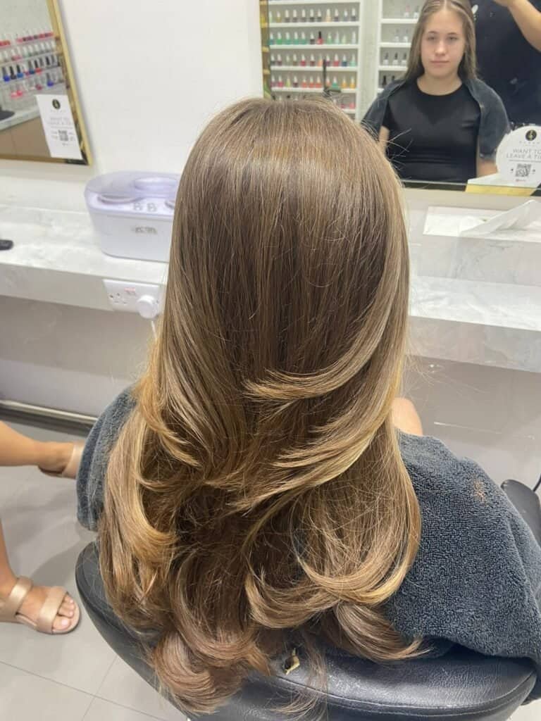 Silky caramel balayage hair coloring at Sasha Beauty Salon Dubai for a natural, trendy look.