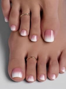 Silky French manicure with white tips on well-groomed nails.